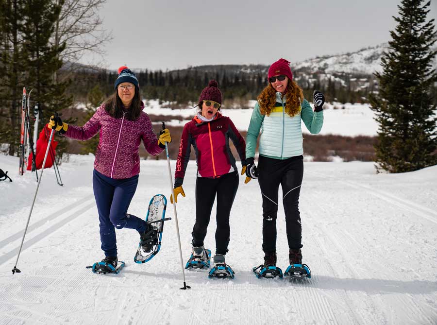 Three snowshoers on the trails